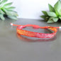 Pulseras tejidas con seda