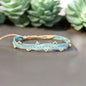 Pulseras de seda con balines bañados en plata